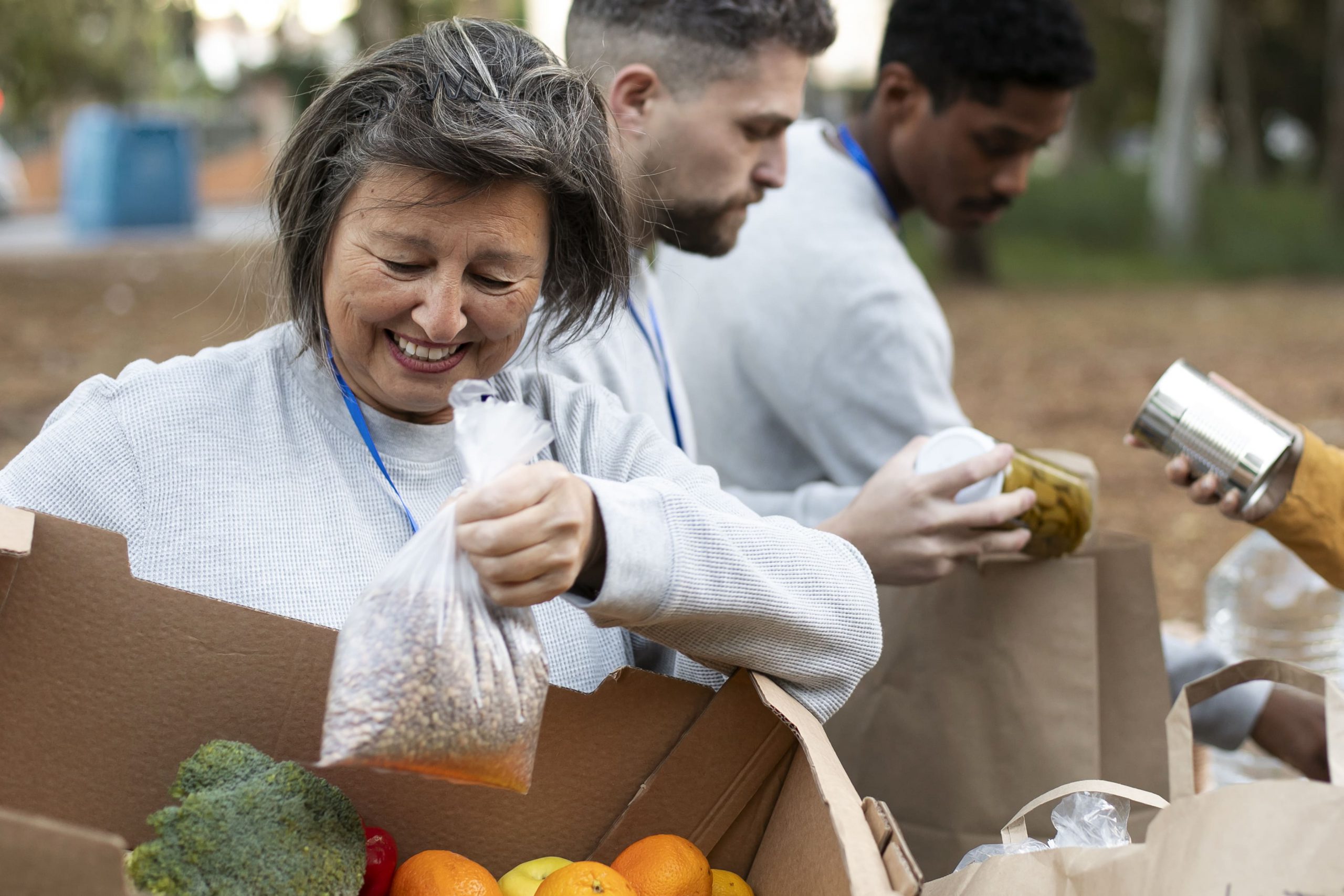 Close Up People With Food Donations