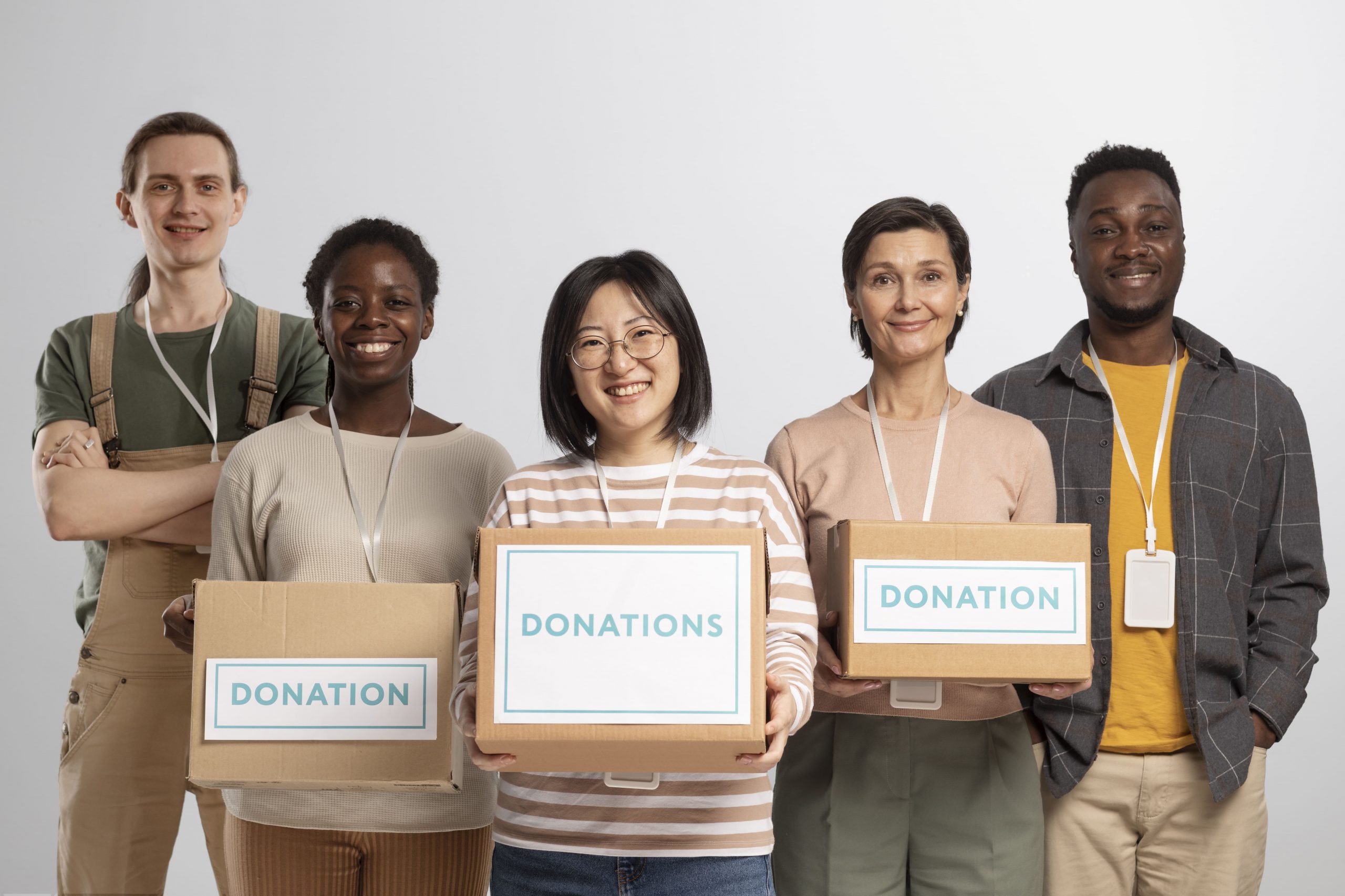 Volunteers Holding Boxes Containing Donations Charity